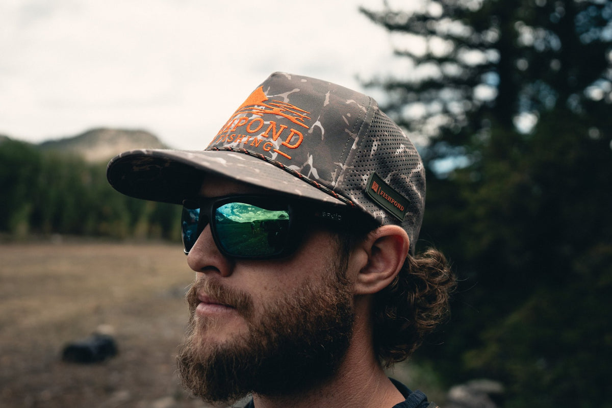Fishpond Trucha Hat, Overcast Camo, worn by angler