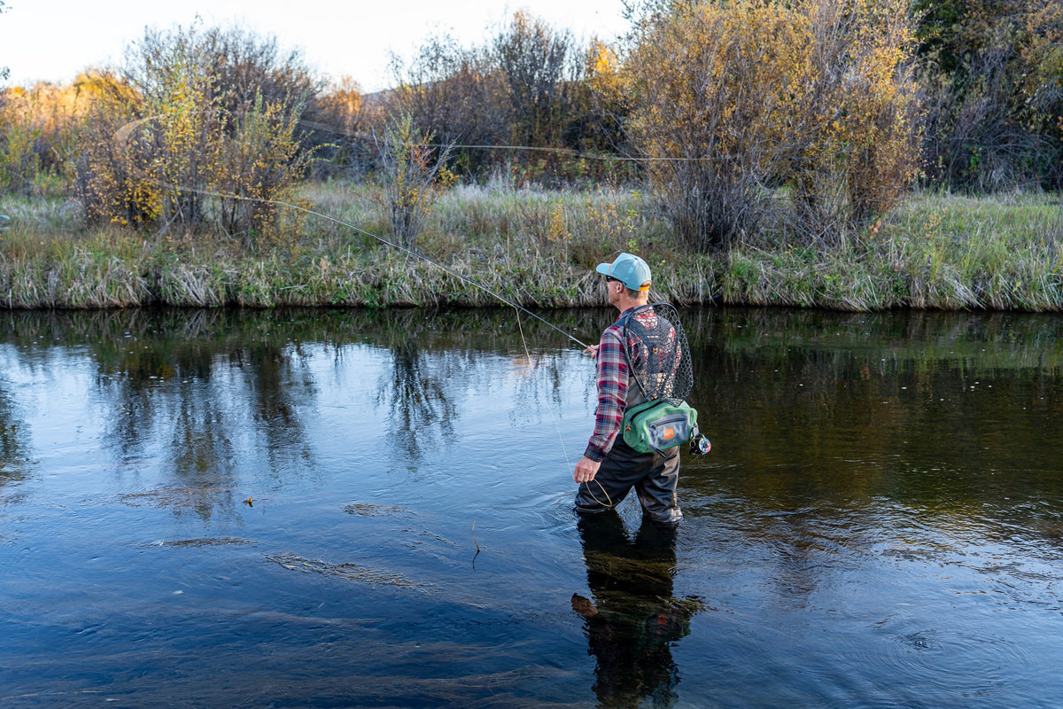 Fishpond Thunderhead HD Lumbar Pack, Yucca, worn by angler wading