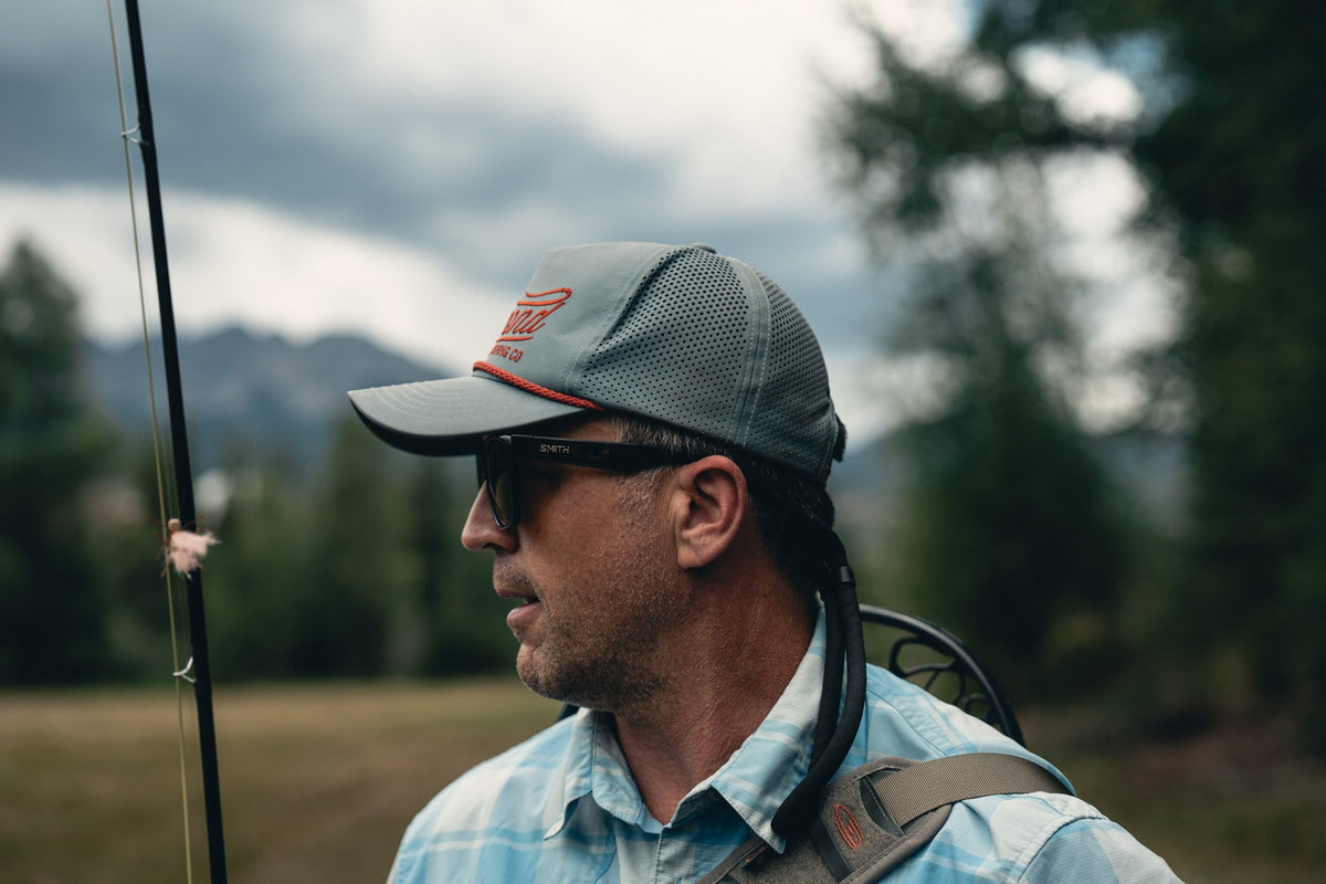 Fishpond Heritage Tech Hat - Tempest, side view worn by angler