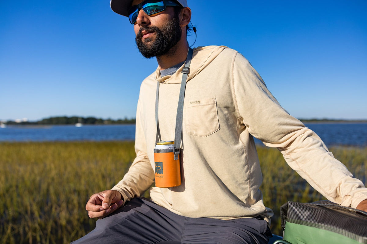 Fishpond River Rat, Cutthroat Orange, worn around angler's neck
