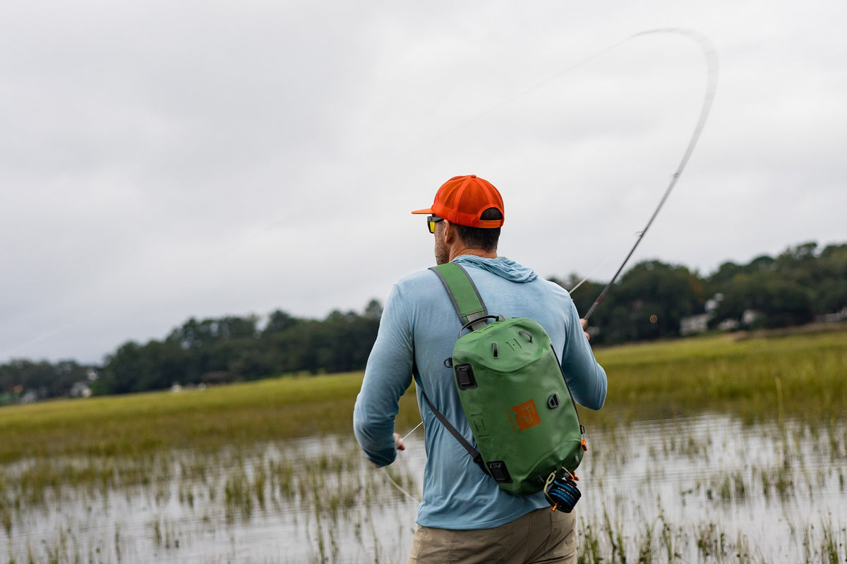Fishpond Thunderhead HD Sling, Yucca, worn by angler casting