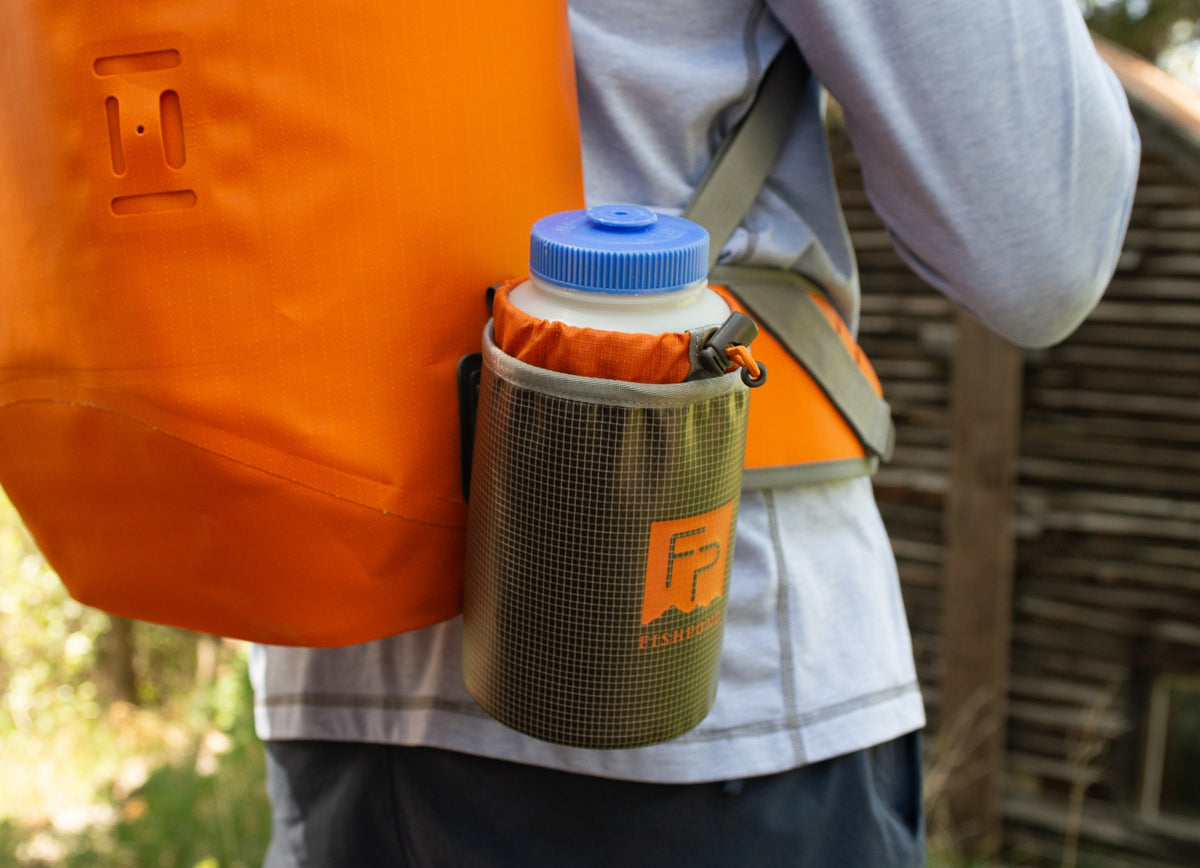 Fishpond Thunderhead Water Bottle Holder - Smoke Grey, holding a water bottle on a backpack