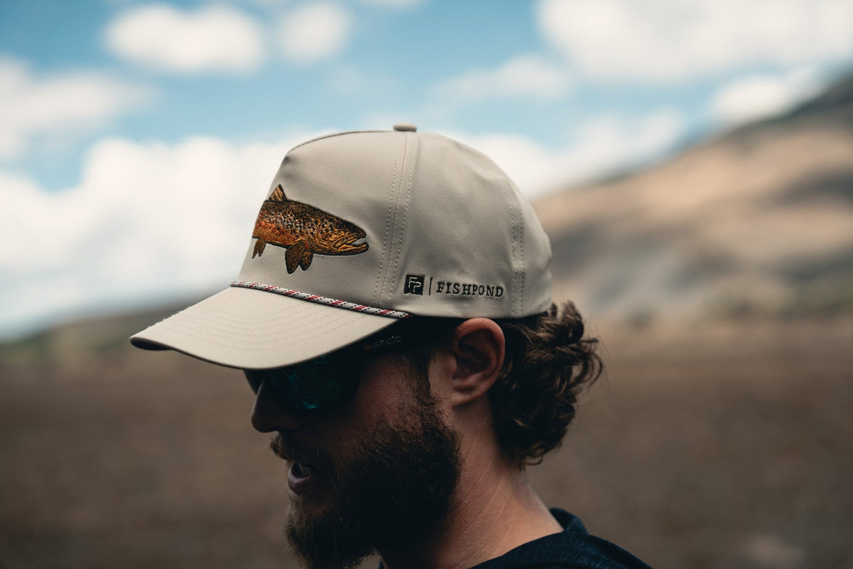 Fishpond Hometown Hat - Sand, side view worn by angler