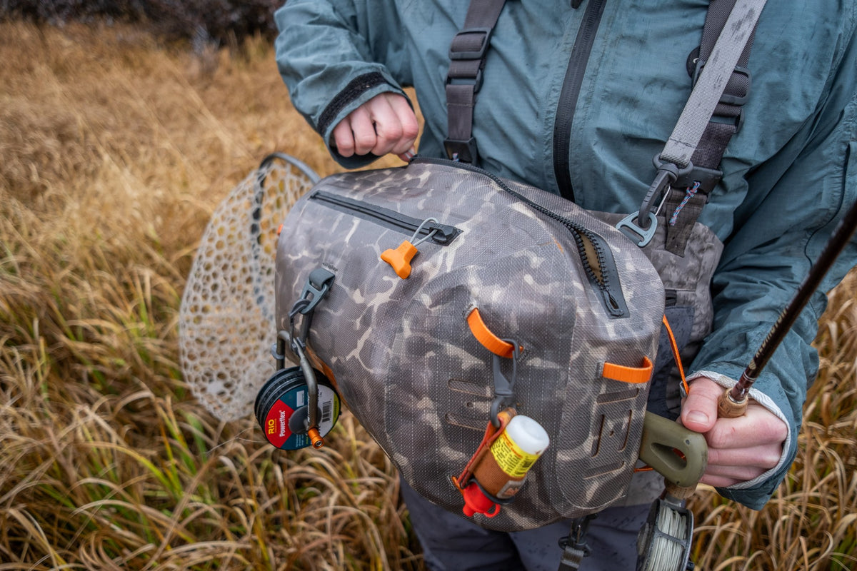 Fishpond Thunderhead HD Sling, Shadowcast Camo, close-up worn with net