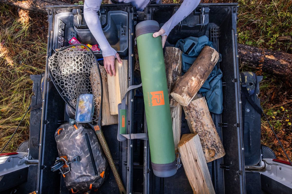 Fishpond Short Haul Rod Case - Yucca, packed in a truck bed