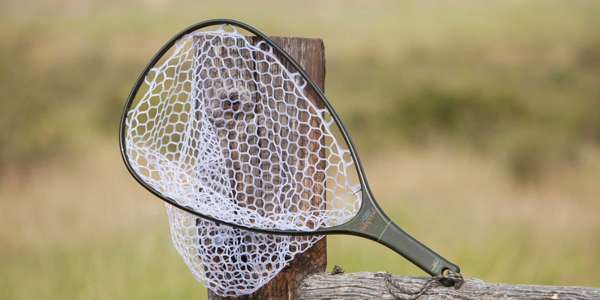 Fishpond Nomad Hand Net - Original On a Fence